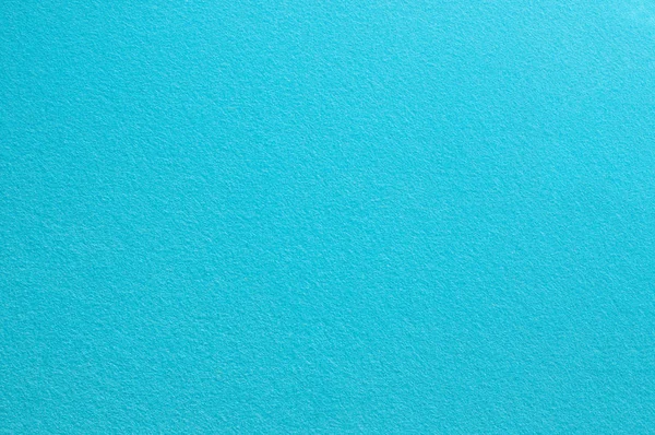 Superficie de fieltro en color azul claro. Fondo abstracto y textura para el diseño . Imagen de archivo