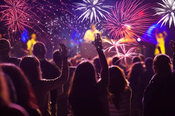 Cheering crowd and fireworks — Stock Photo, Image