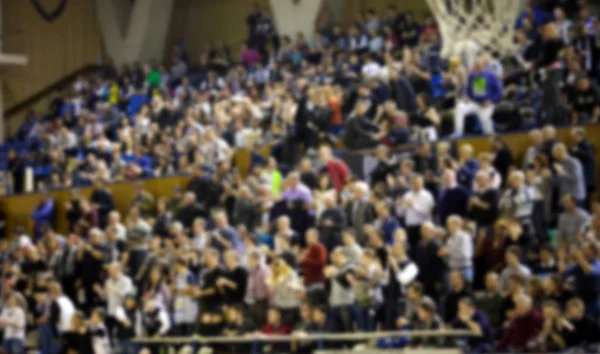 blurred background of crowd of people in a basketball court