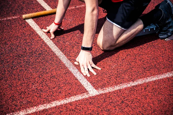 Hands on starting line — Stock Photo, Image