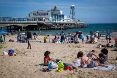 BOURNEMOUTH, UK - 1st JUNE, 2017: Bournemouth beach pier and coast, Dorset, England clipart