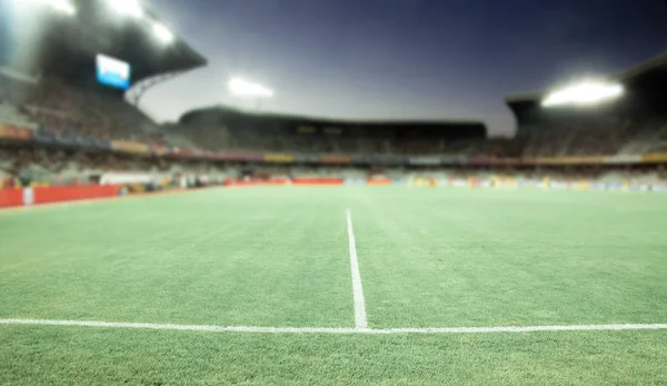 Evening stadium arena soccer field defocused background — Stock Photo, Image