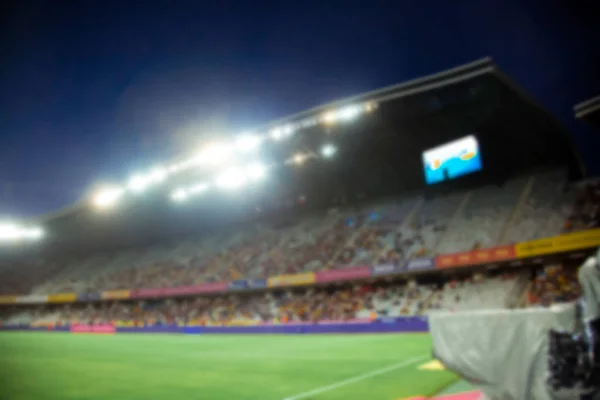 Estádio da noite arena campo de futebol desfocado fundo — Fotografia de Stock