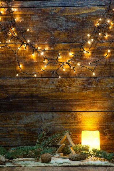 Christmas decorations and lights on wooden background — Stock Photo, Image