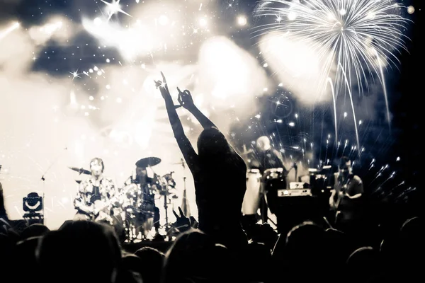 New Year concept - cheering crowd and fireworks — Stock Photo, Image