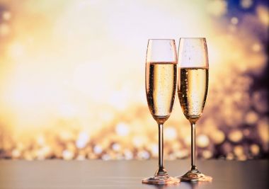 two champagne glasses ready to bring in the New Year clipart