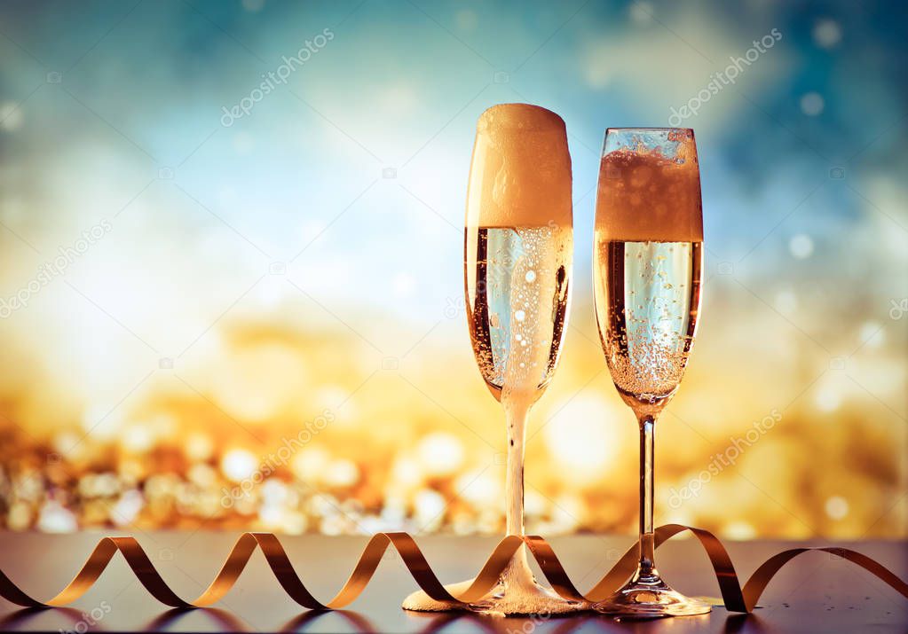 two champagne glasses ready to bring in the New Year