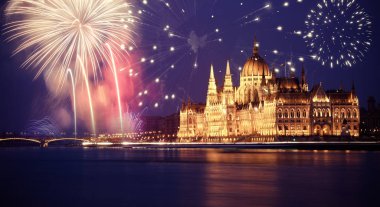 new Year in the city - Budapest Parliament with fireworks clipart