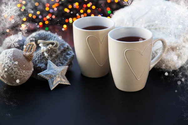 Hot tea in white cup and Christmas decorations - cozy winter day — Stock Photo, Image