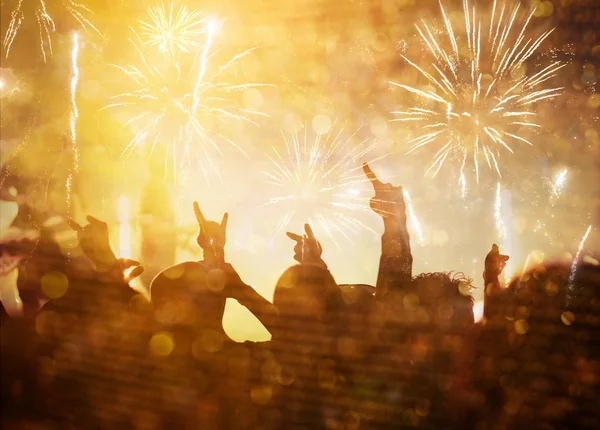 New Year concept - cheering crowd and fireworks — Stock Photo, Image