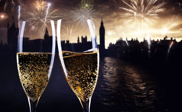 celebrating new year\'s eve in the city - toasting with champagne