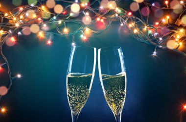 two champagne glasses ready to bring in the New Year - holiday l clipart