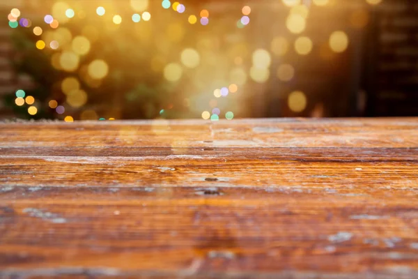 Empty wooden board and christmas lights — Stock Photo, Image