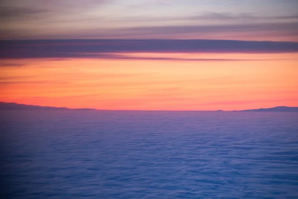 Amazing sunrise over the clouds — Stock Photo, Image