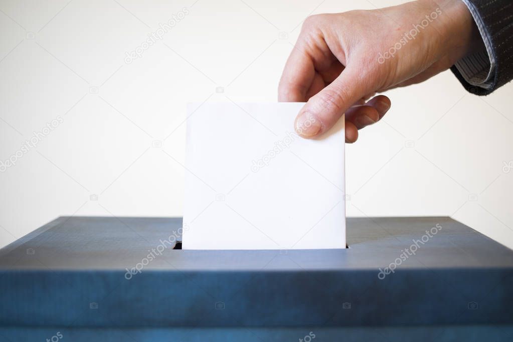 elections  hand  putting  vote in the ballot box