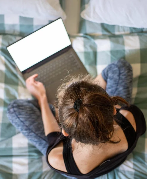 Woman Using Laptop Tablet Bed White Empty Screen Copy Space — Stock Photo, Image