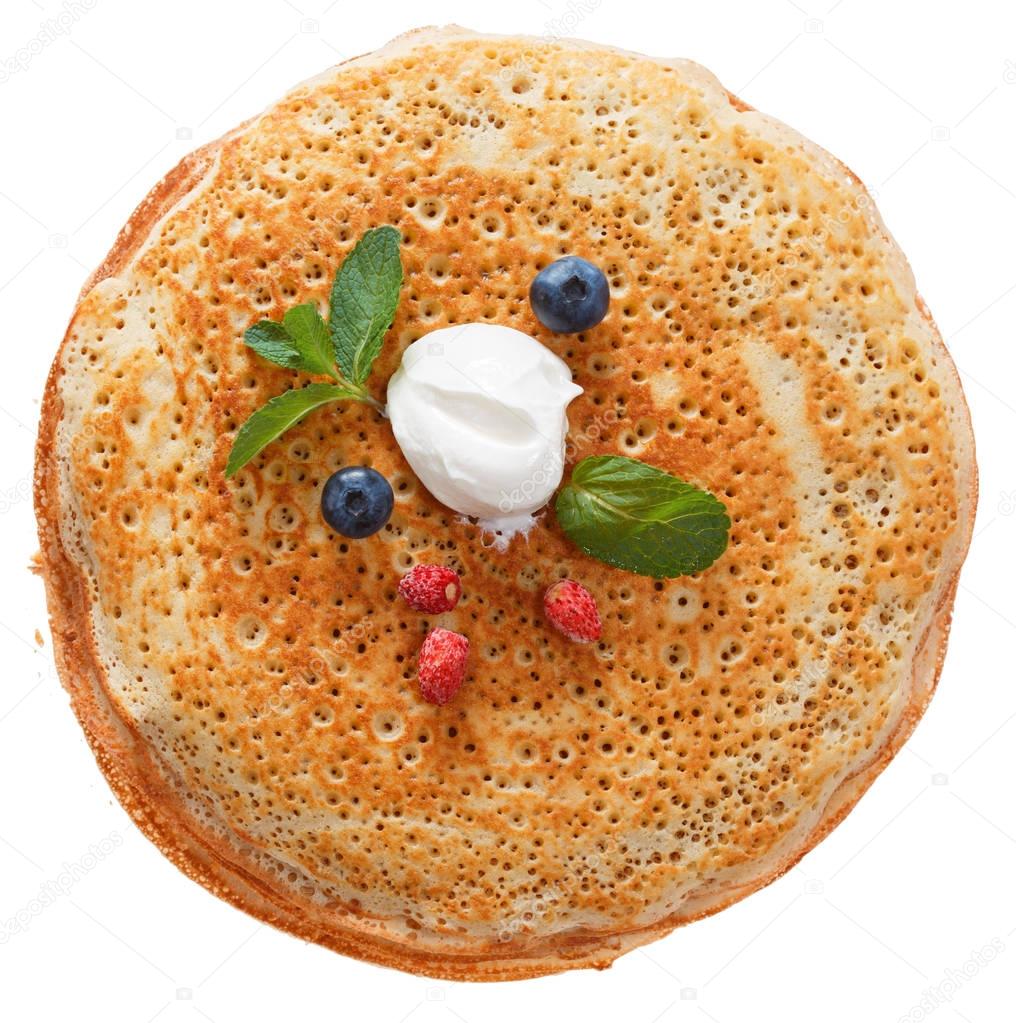 The top view on pancakes with holes.