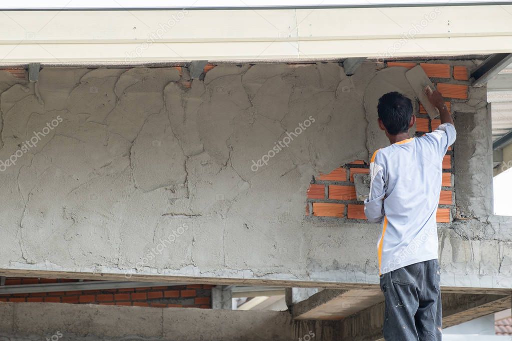 Builders are plastering walls