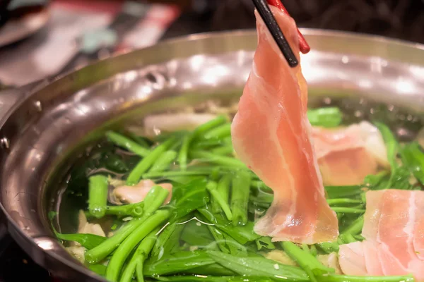 Meat in a shabu-shabu pot — 스톡 사진