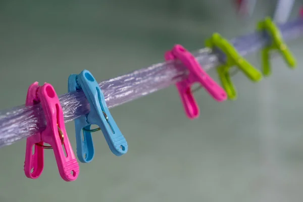 Multi-colored clips on the rope — Stock Photo, Image