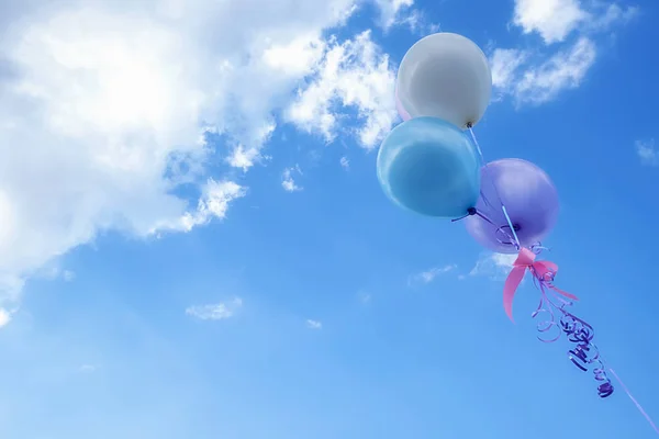 Balloons done on the yellow flower garden concept of love in summer. Retro filter effect, selective focus — Stock Photo, Image