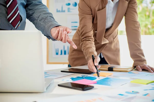 Business working at office with laptop and documents on his desk — Stock Photo, Image