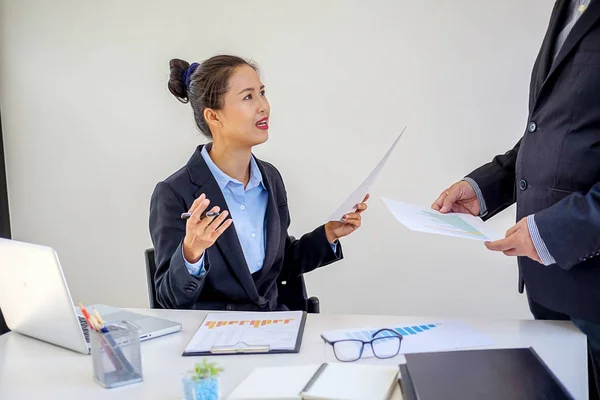 Female leaders speaking about the results discussing documents — Stock Photo, Image