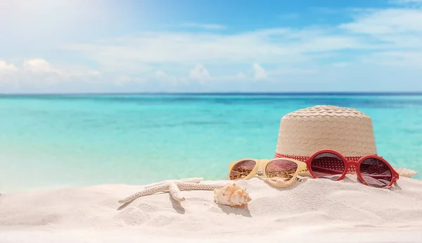 Summer vacation concept with accessories on sandy beach — Stock Photo, Image