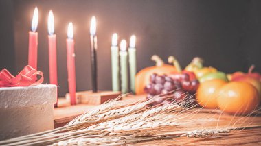 Kwanzaa holiday concept with decorate seven candles red, black a clipart