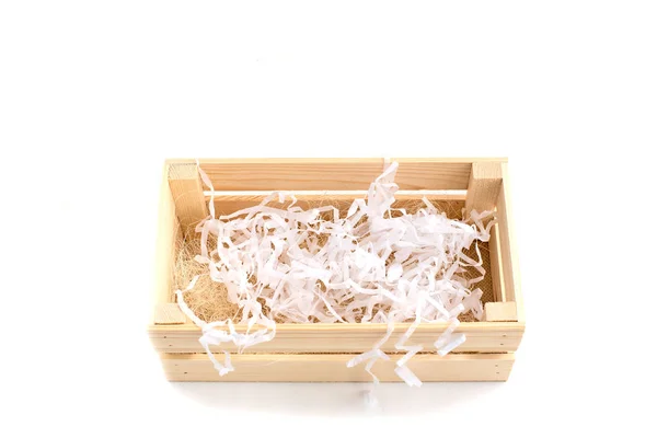 Houten kist met papier vuller op witte achtergrond — Stockfoto