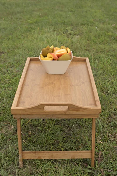 Fruit Cup stands on a wooden table.