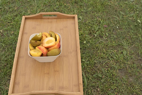 Fruit Cup stands on a wooden table.