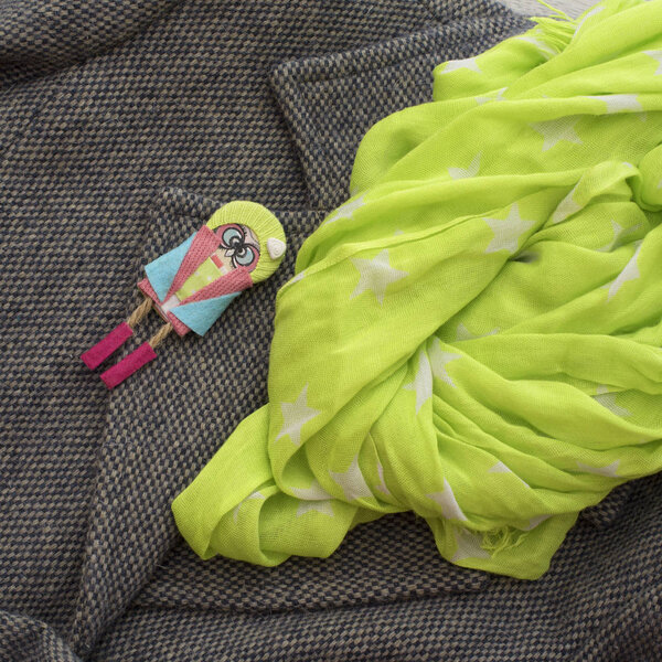 Women's coat gray color and scarf yellow.