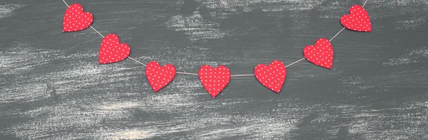 Banner Valentine\'s day background with Decorative composition garland on painted wood background.