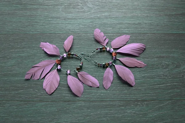 Long earrings for women with feathers.