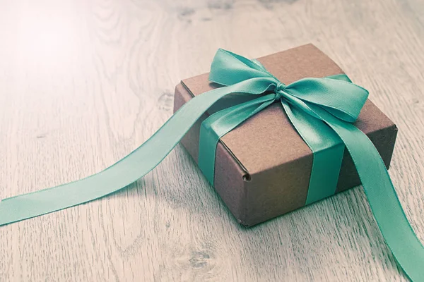 Decorative gift boxes on wooden background.