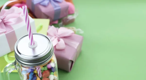 Festive composition set of gift boxes with balls candy cocktail materials.