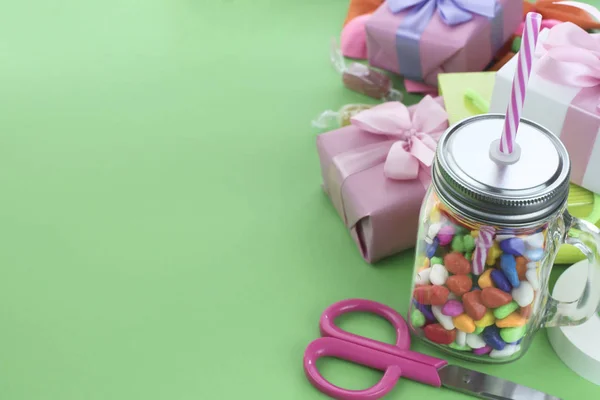 Festive composition set of gift boxes with balls candy cocktail materials.