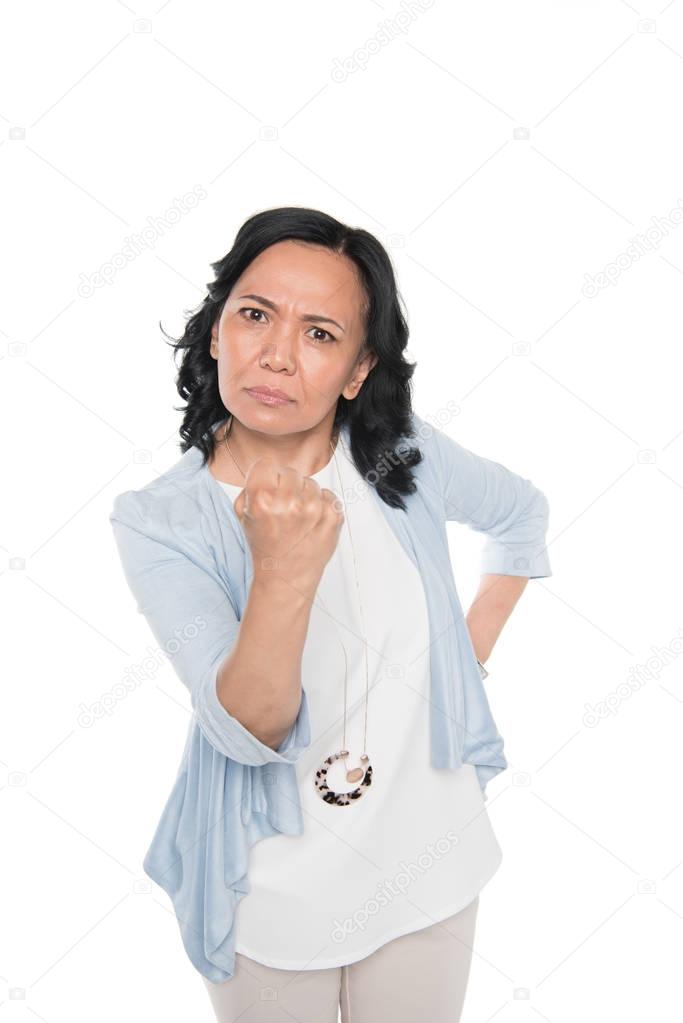 casual asian woman menace with fist