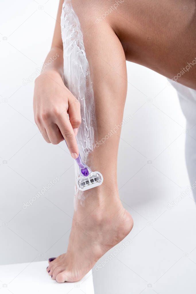 woman shaving legs