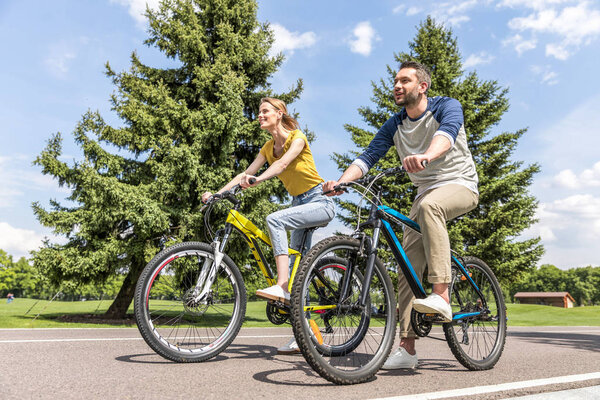 couple riding on bicycles  