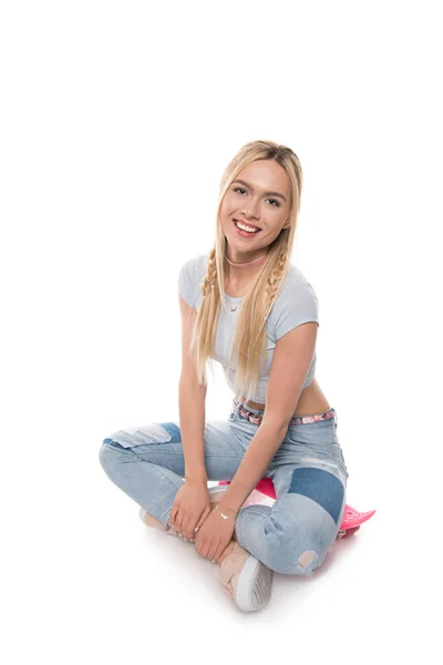 Young woman with skateboard — Stock Photo, Image