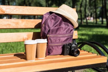 Backpack with camera and paper cups clipart