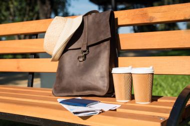 Leather bag and paper cups