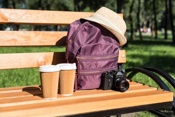 Backpack with camera and paper cups