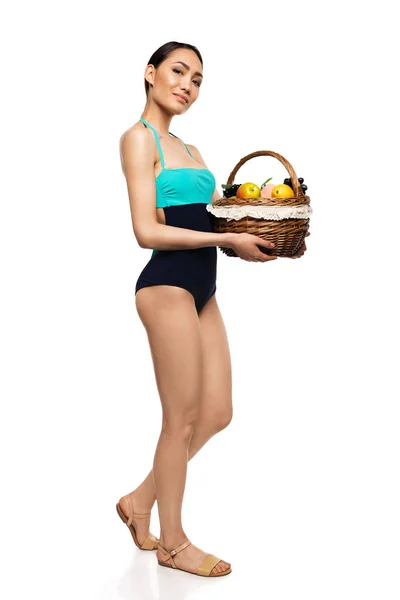 Woman in swimsuit with fruits — Stock Photo, Image