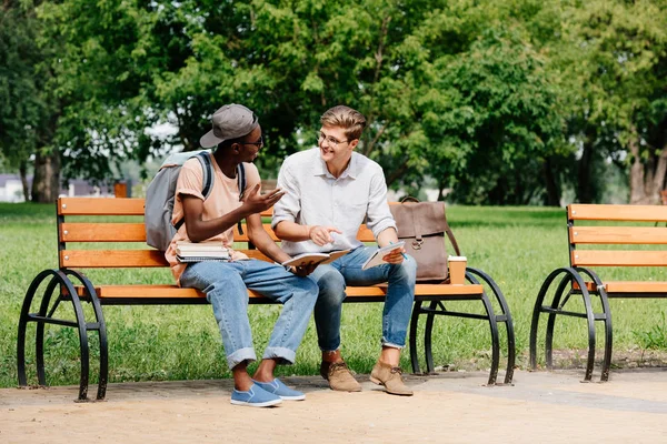 Multicultural students studying in park — Stock Photo, Image