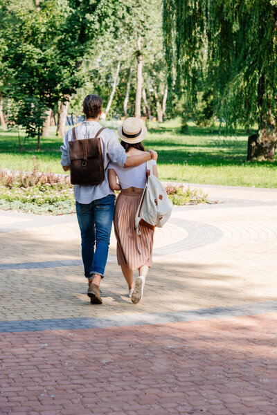 couple walking in summer park