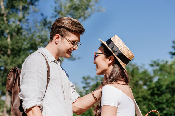 multicultural couple in park