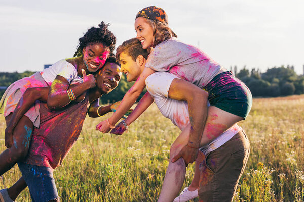 multiethnic couples at holi festival